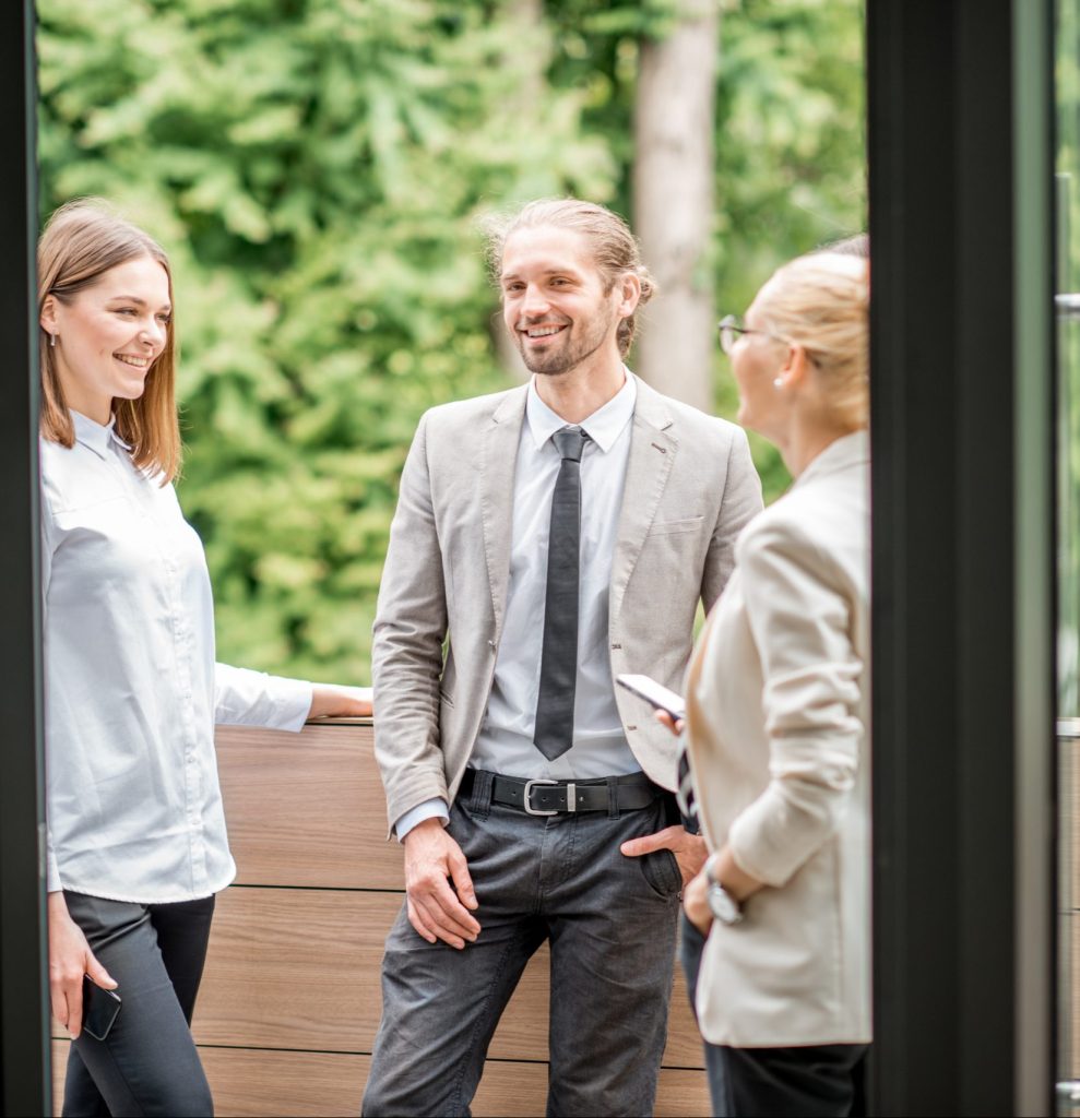 Group of business people in real estate conversing